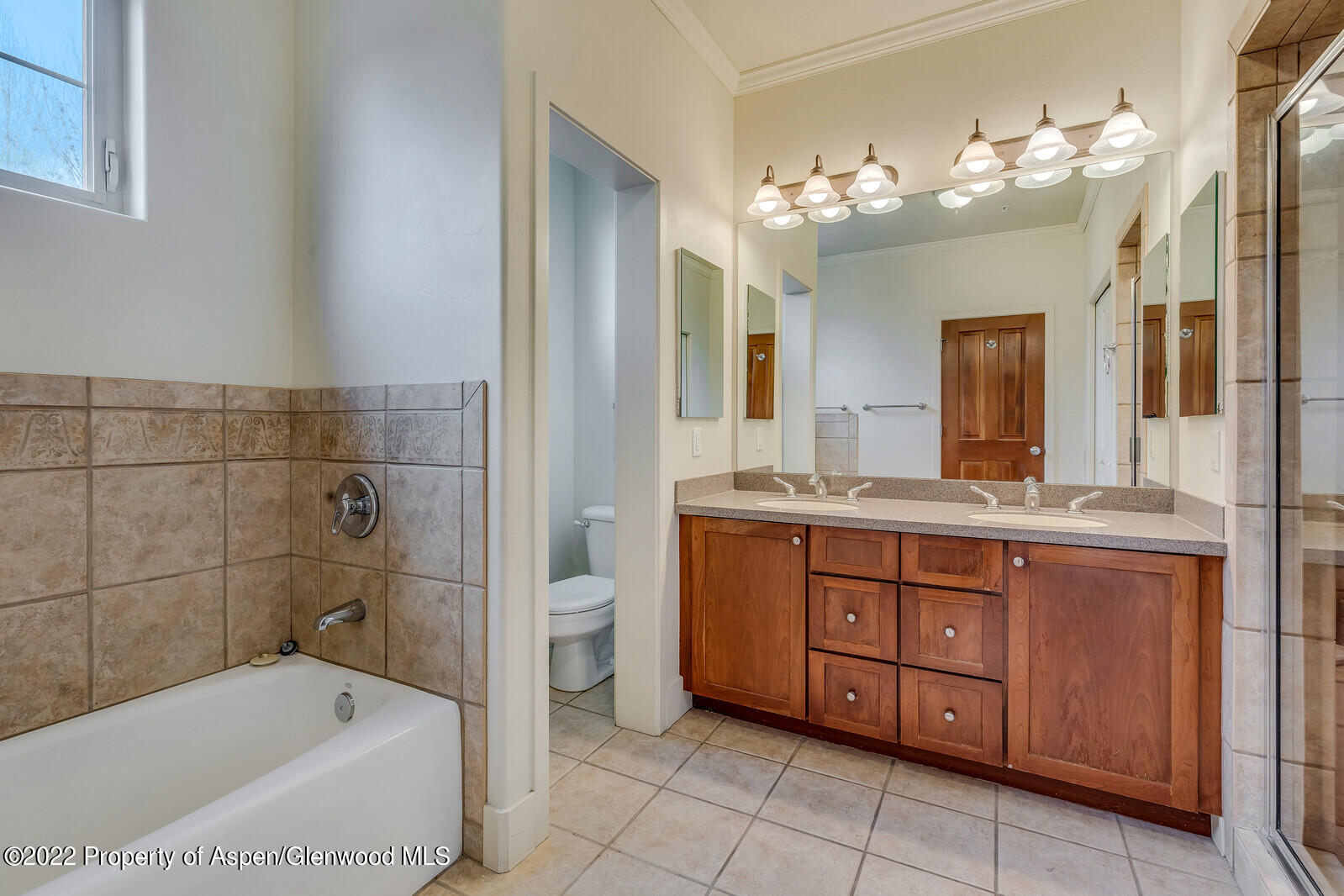 536 Evans Court Basalt, CO 81621 - Photo 10 of 19 a bathroom with a tub sink and mirror