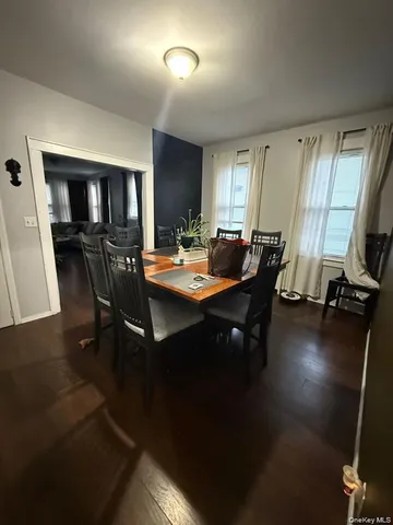 a view of a dining room with furniture and window