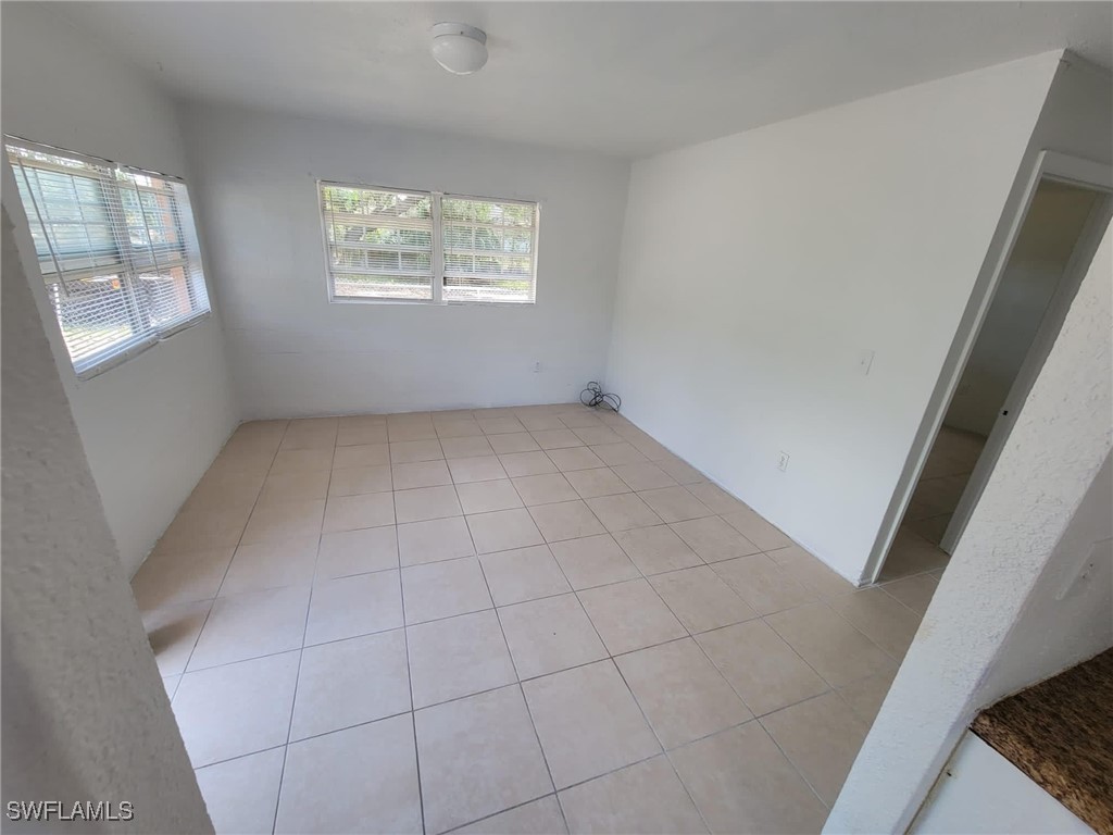 2640-2642 St Charles Street Fort Myers, FL 33916 - Photo 3 of 12 an empty room with windows
