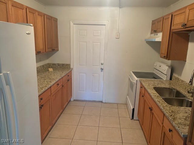 2640-2642 St Charles Street Fort Myers, FL 33916 - Photo 10 of 12 a kitchen with a sink stove and refrigerator