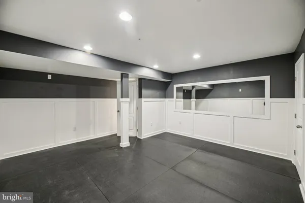a bathroom with a double vanity sink toilet mirror and shower