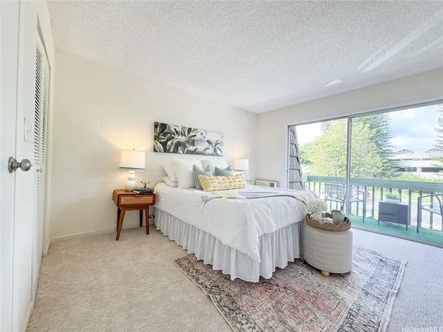 a bedroom with a bed and a table