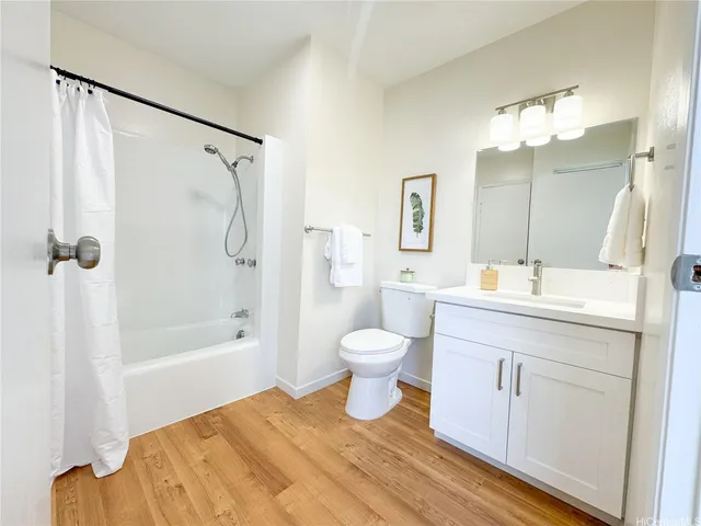 a bathroom with a sink toilet a shower and a mirror