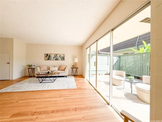 a living room with couch and a table