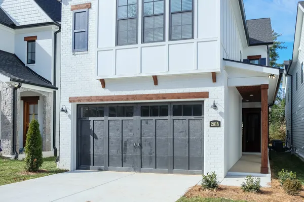 a front view of a house with parking