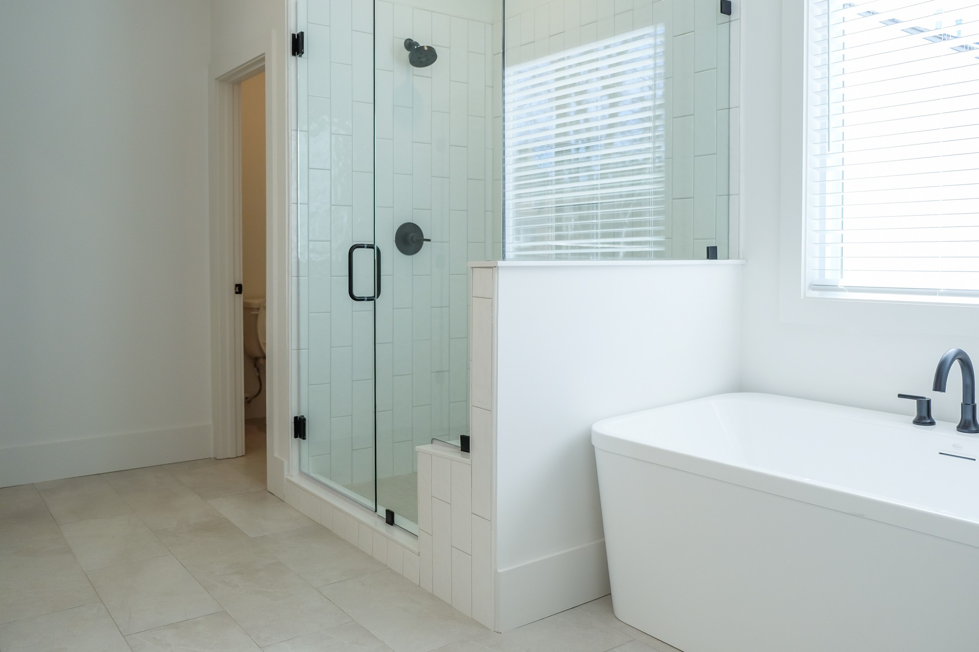 2818 Valley Road Nashville, TN 37215 - Photo 13 of 21 a bathroom with a tub a sink and window