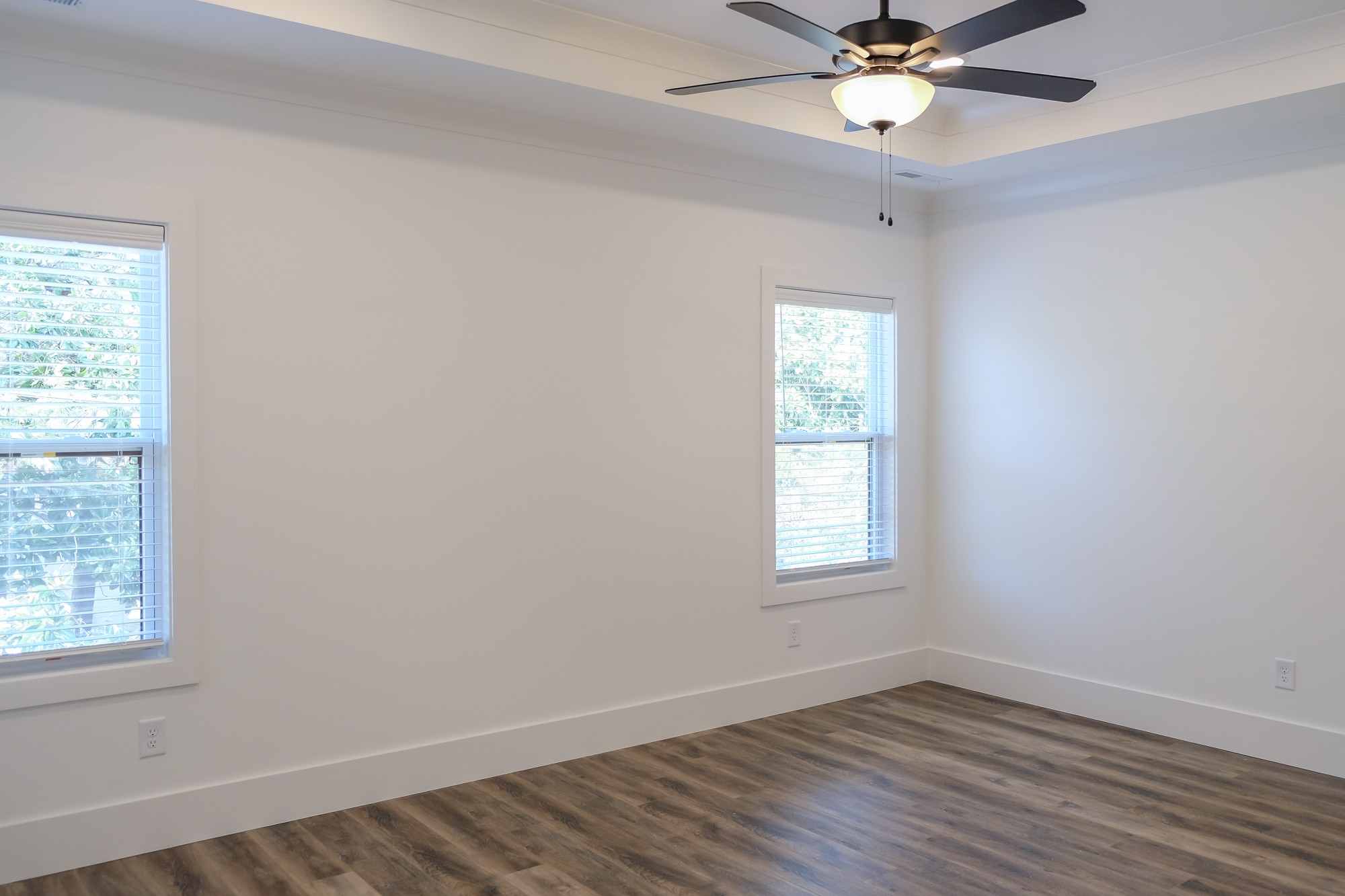 2818 Valley Road Nashville, TN 37215 - Photo 16 of 21 an empty room with wooden floor windows and fan