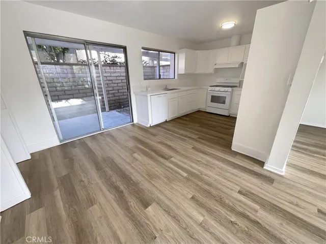 a room with a bed and a large window