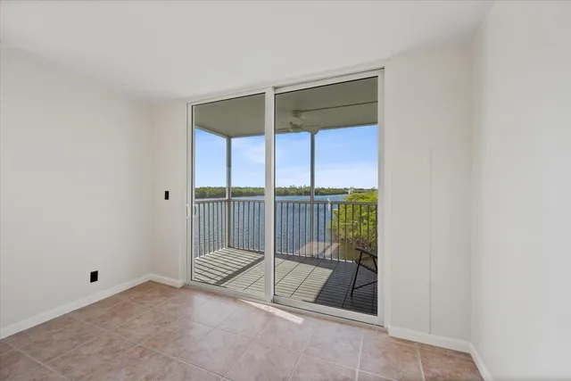 a view of a room with wooden floor and fence