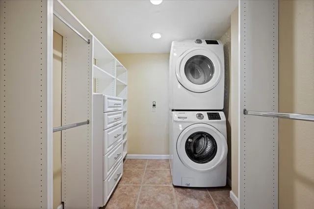 a utility room with sink dryer and washer