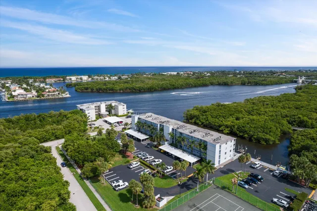 an aerial view of a house with a lake view
