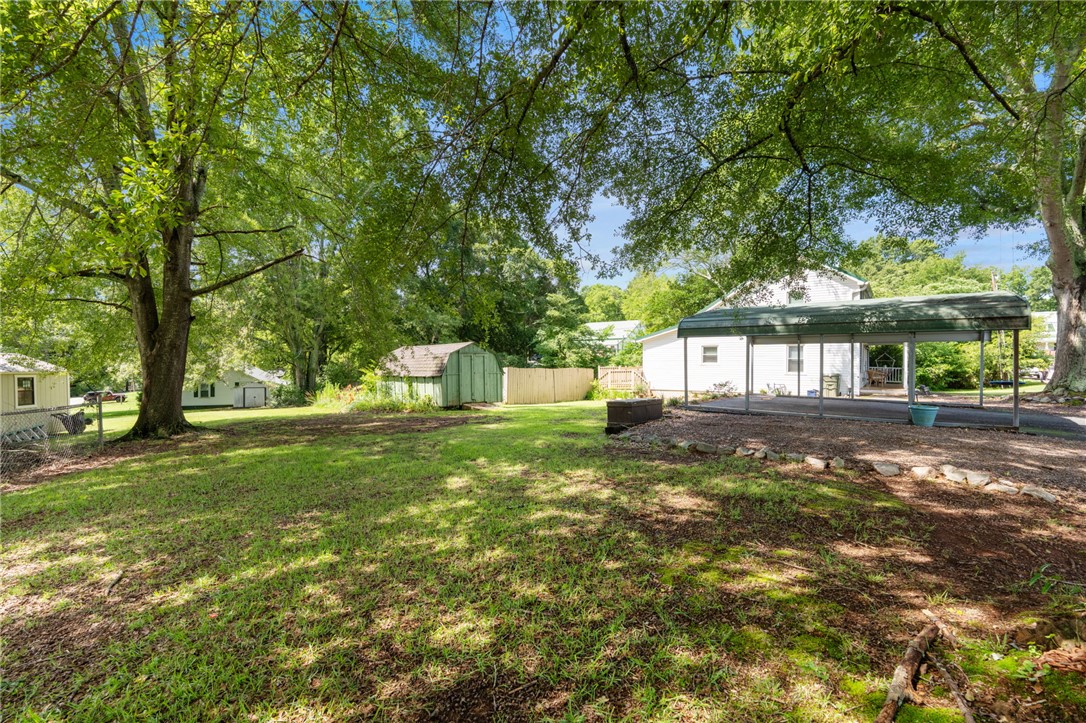 108 Tarrant Street Central, SC 29630 - Photo 30 of 42 A spacious, verdant yard shaded by mature trees offers ample room for outdoor activities.