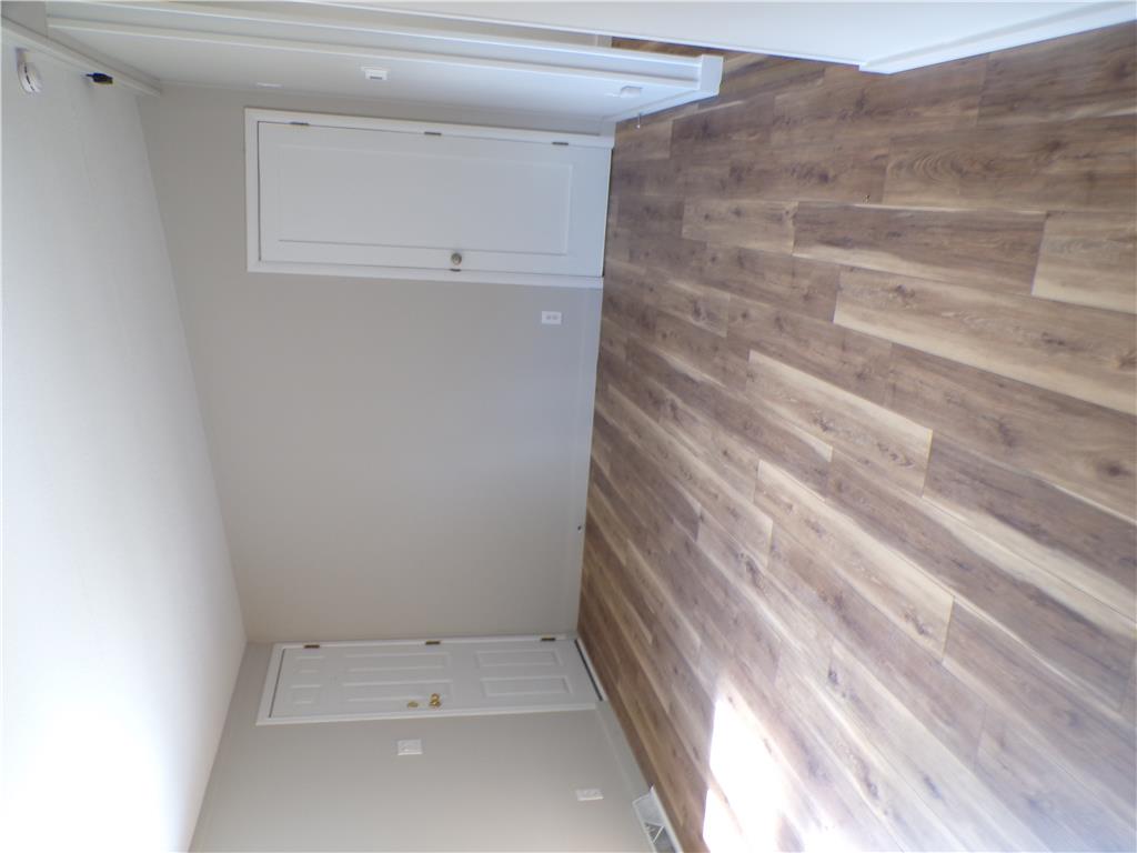 7877 Gun Club Road New Tripoli, PA 18066 - Photo 3 of 19 Warm wood-look flooring sets a welcoming tone in this versatile space.