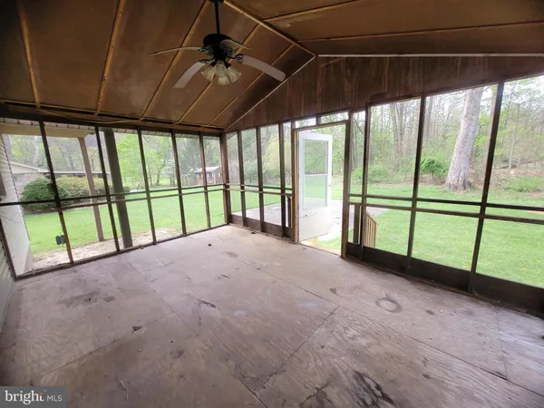 a view of empty room with sliding door