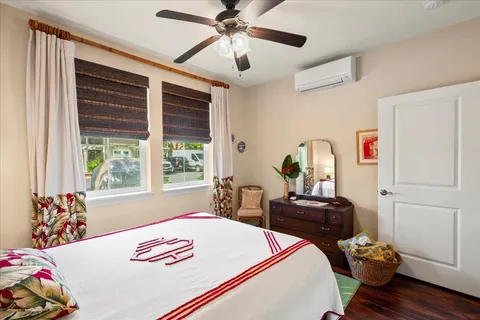 a bedroom with bed and a dresser