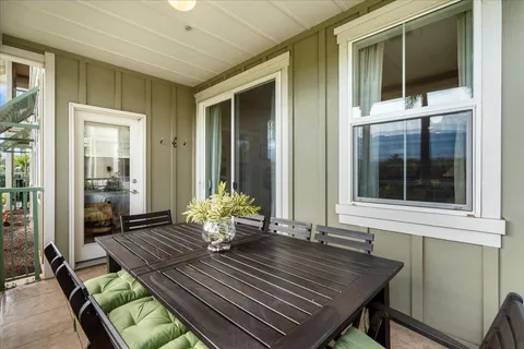 a view of two chairs in the balcony