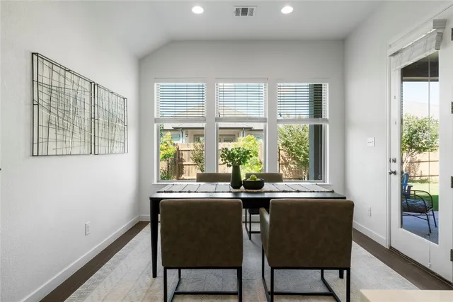 a bed room with a bed and a chandelier