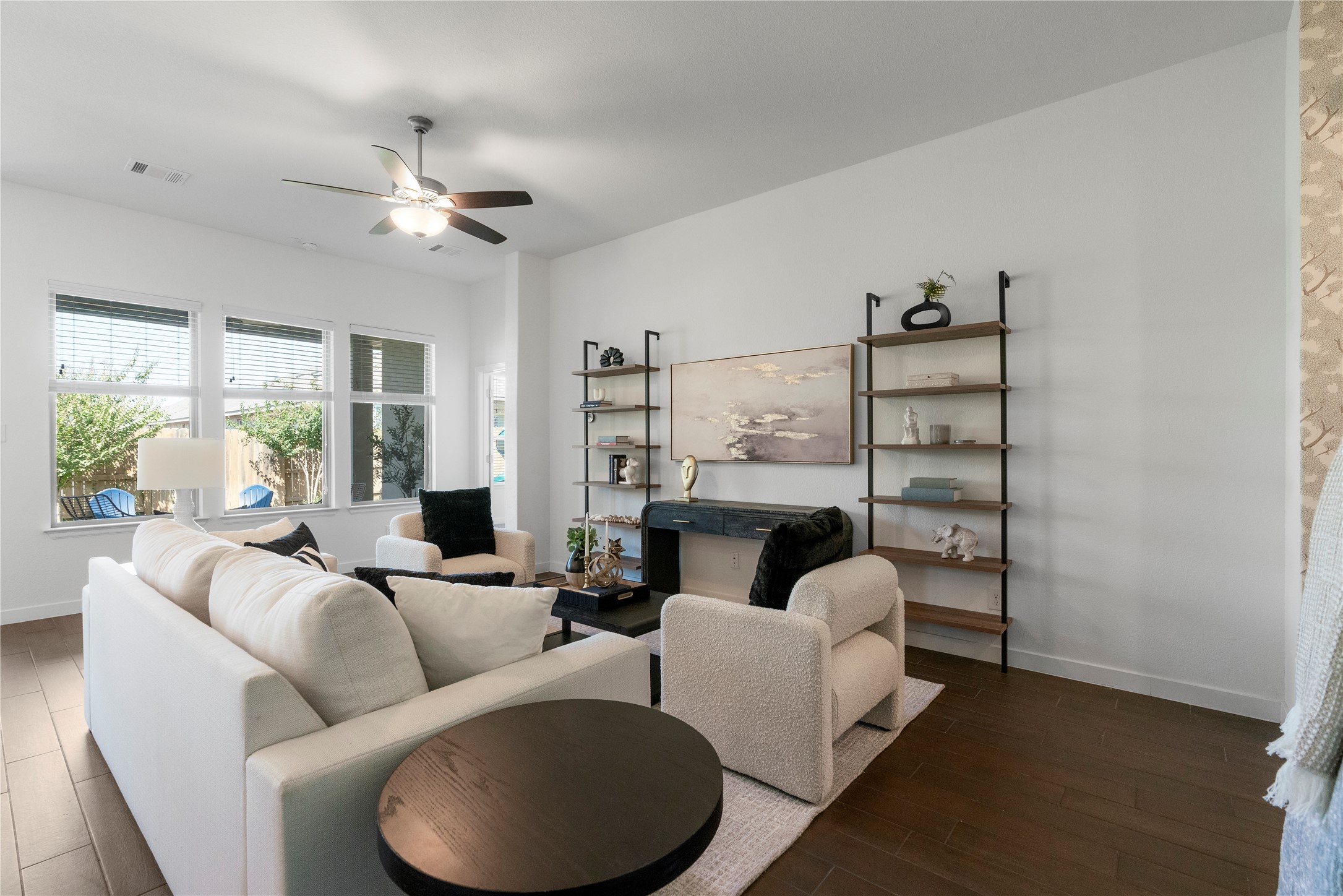 2021 Josiah Cove Leander, TX 78641 - Photo 31 of 35 Living area with a ceiling fan and dark wood-style floors