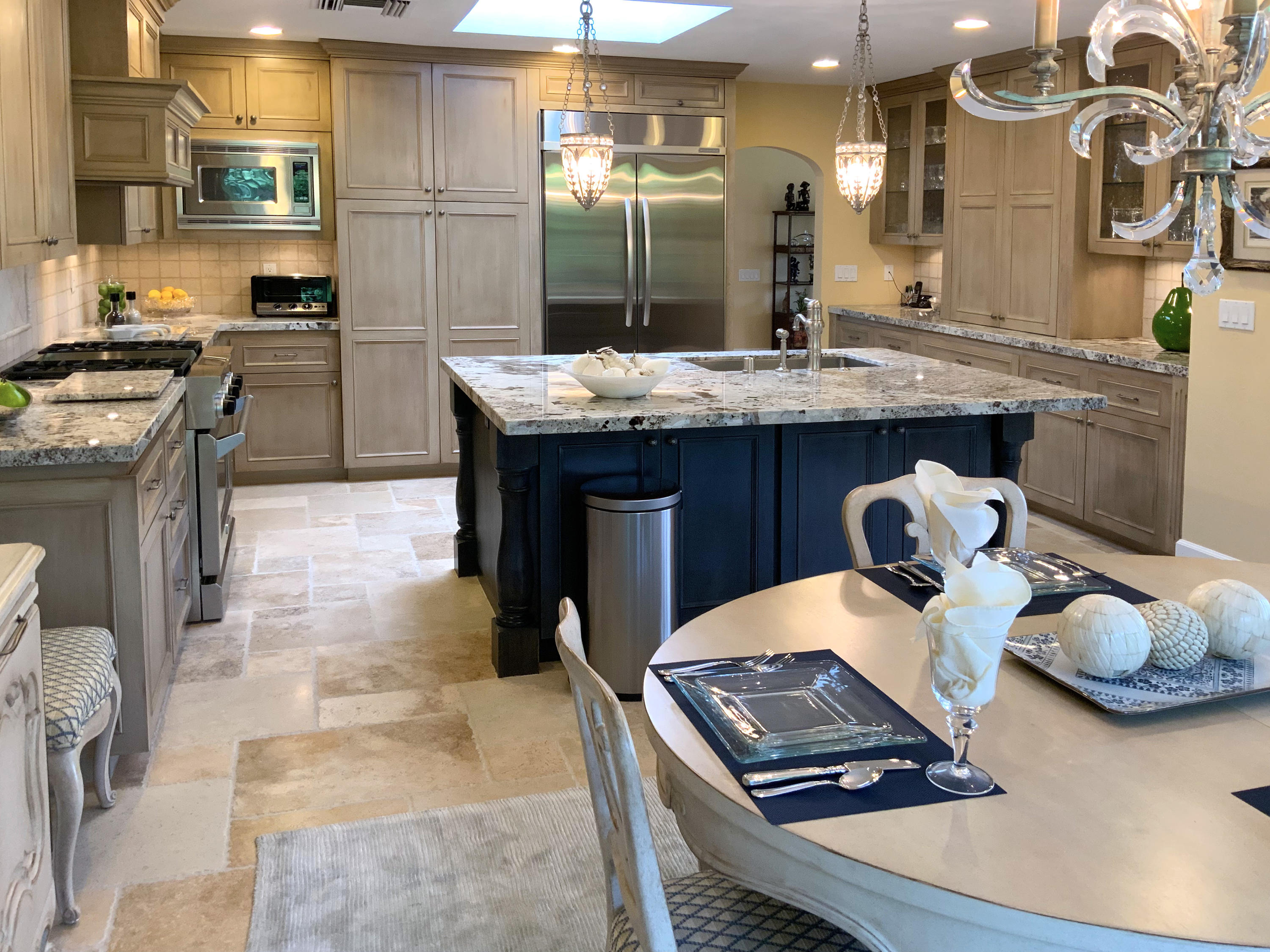 a room with furniture and view of kitchen