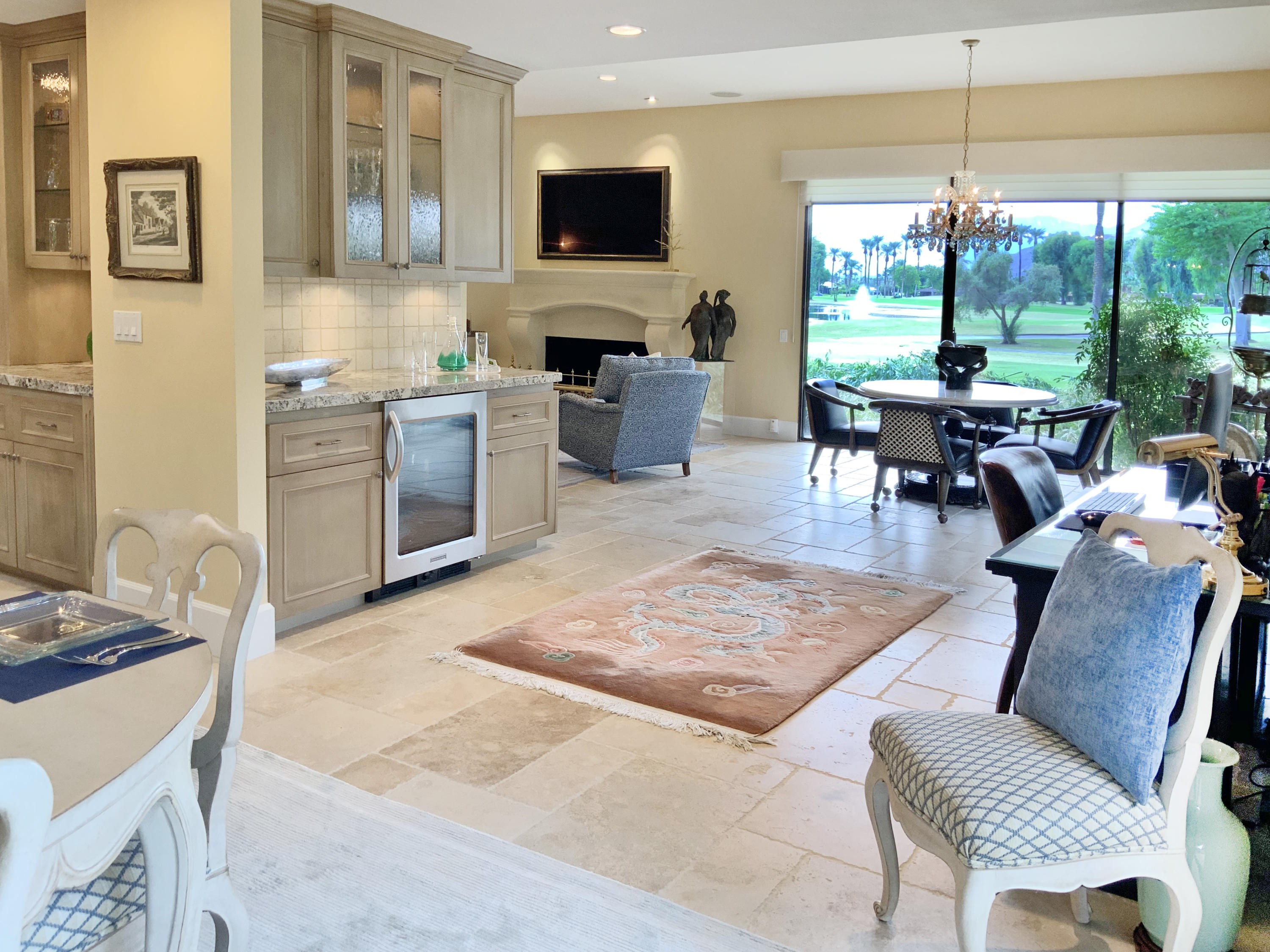 7 Princeton Drive Rancho Mirage, CA 92270 - Photo 11 of 39 a living room with furniture a flat screen tv and a floor to ceiling window