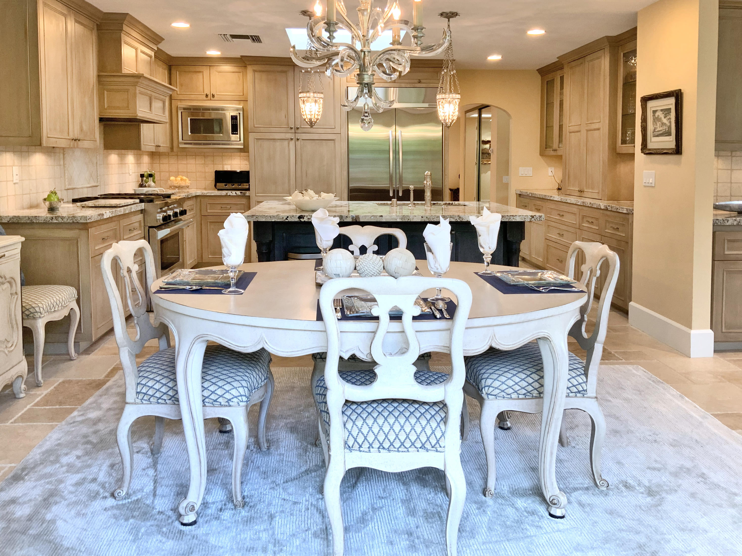 7 Princeton Drive Rancho Mirage, CA 92270 - Photo 12 of 39 a large kitchen with a table and chairs