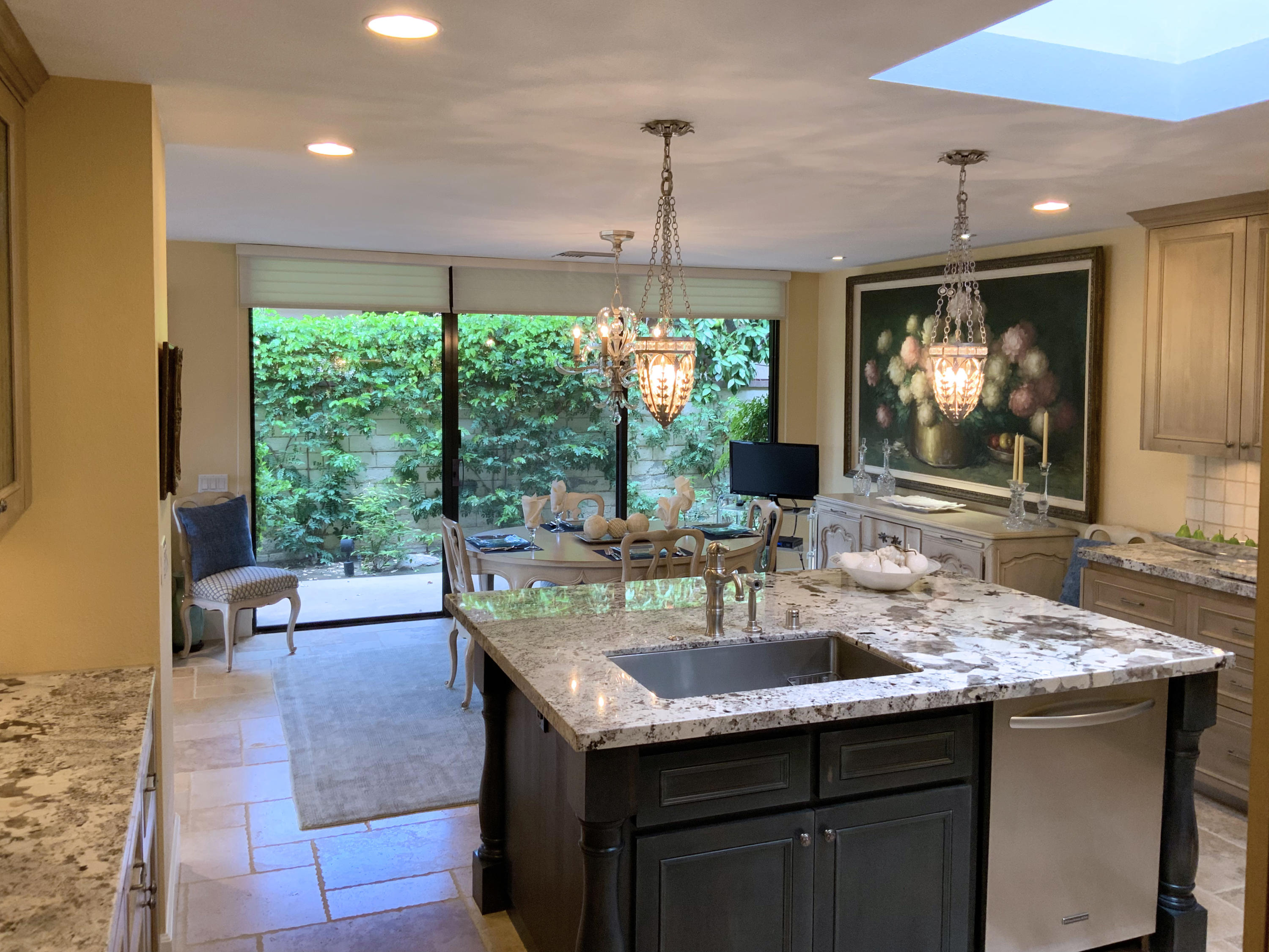 7 Princeton Drive Rancho Mirage, CA 92270 - Photo 13 of 39 a kitchen with kitchen island granite countertop a sink and a large window