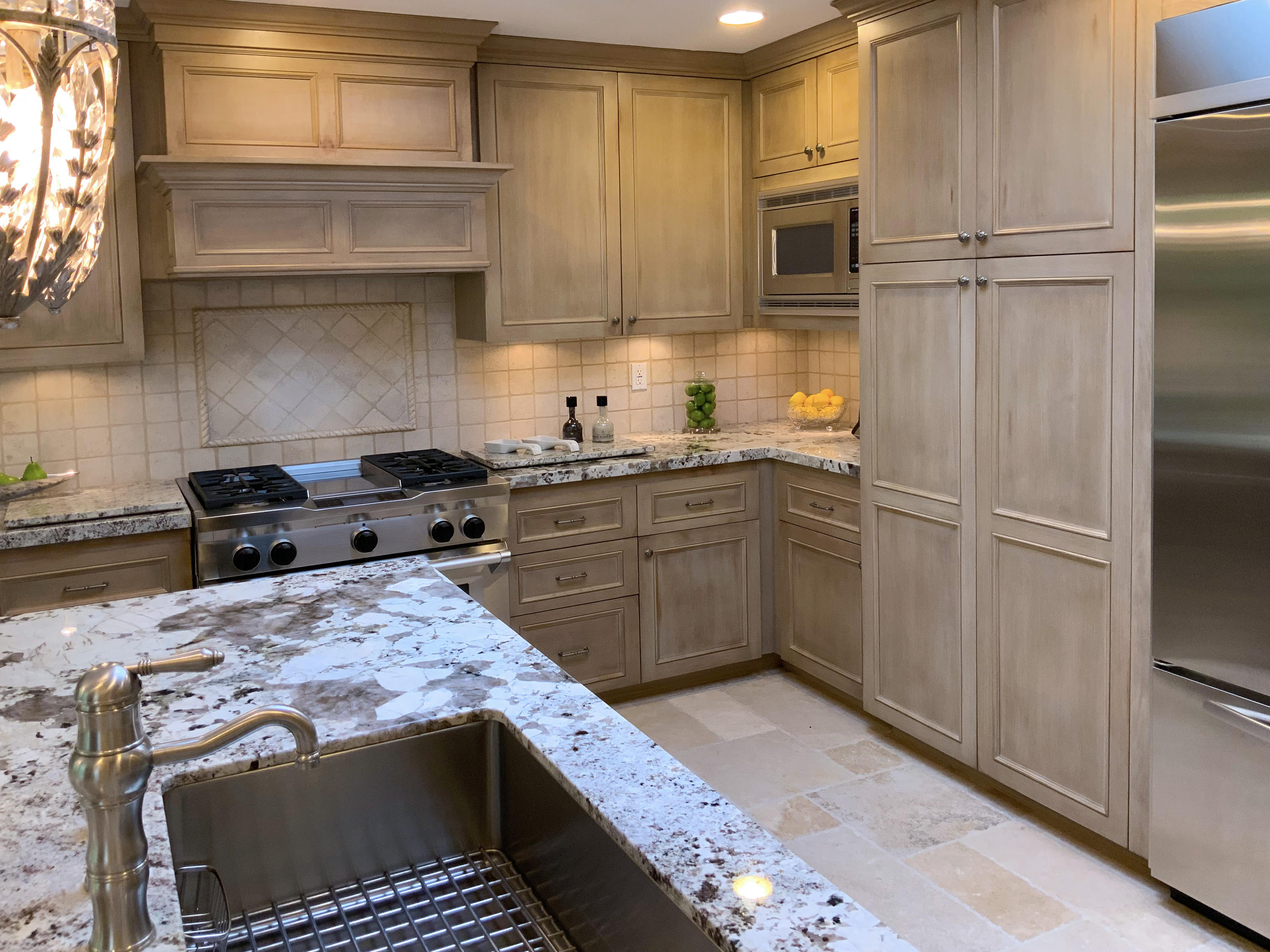 7 Princeton Drive Rancho Mirage, CA 92270 - Photo 16 of 39 a kitchen with stainless steel appliances granite countertop a stove a sink and a refrigerator