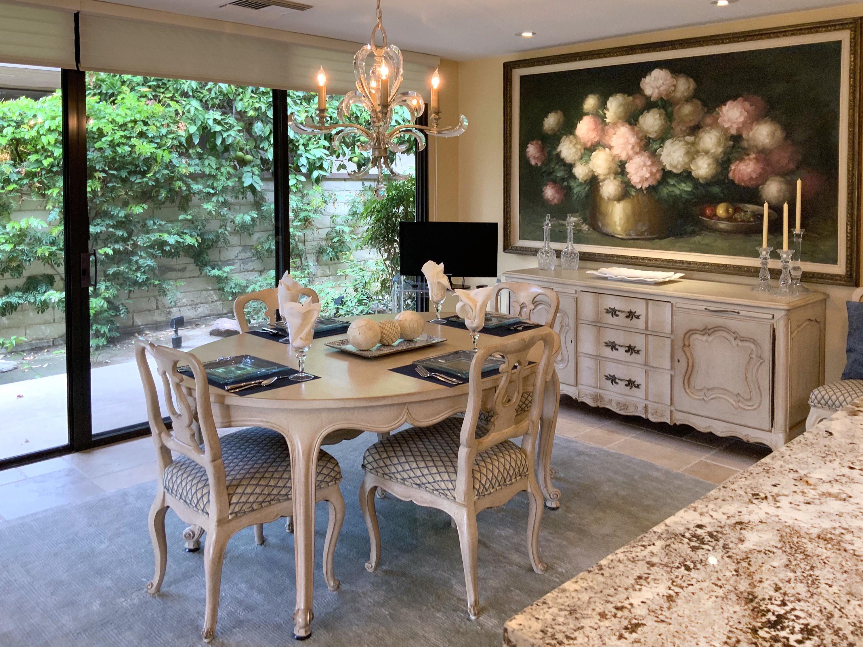 7 Princeton Drive Rancho Mirage, CA 92270 - Photo 18 of 39 a dining room with furniture a large window and a fireplace