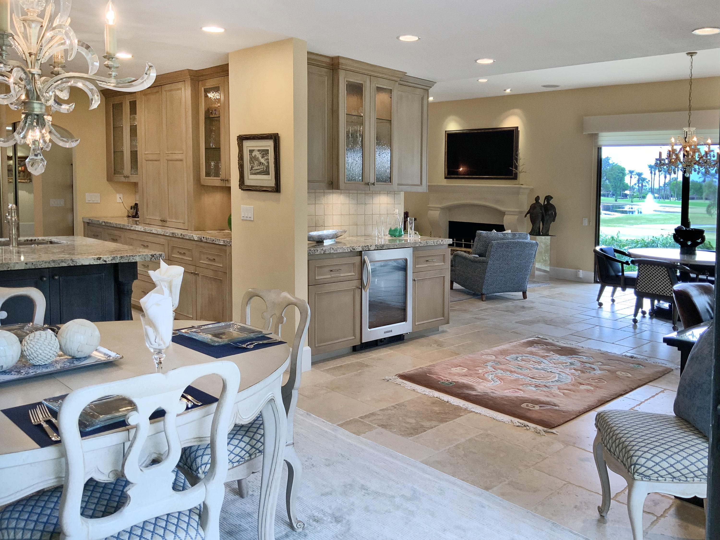 7 Princeton Drive Rancho Mirage, CA 92270 - Photo 19 of 39 a living room with stainless steel appliances furniture a rug and a view of kitchen