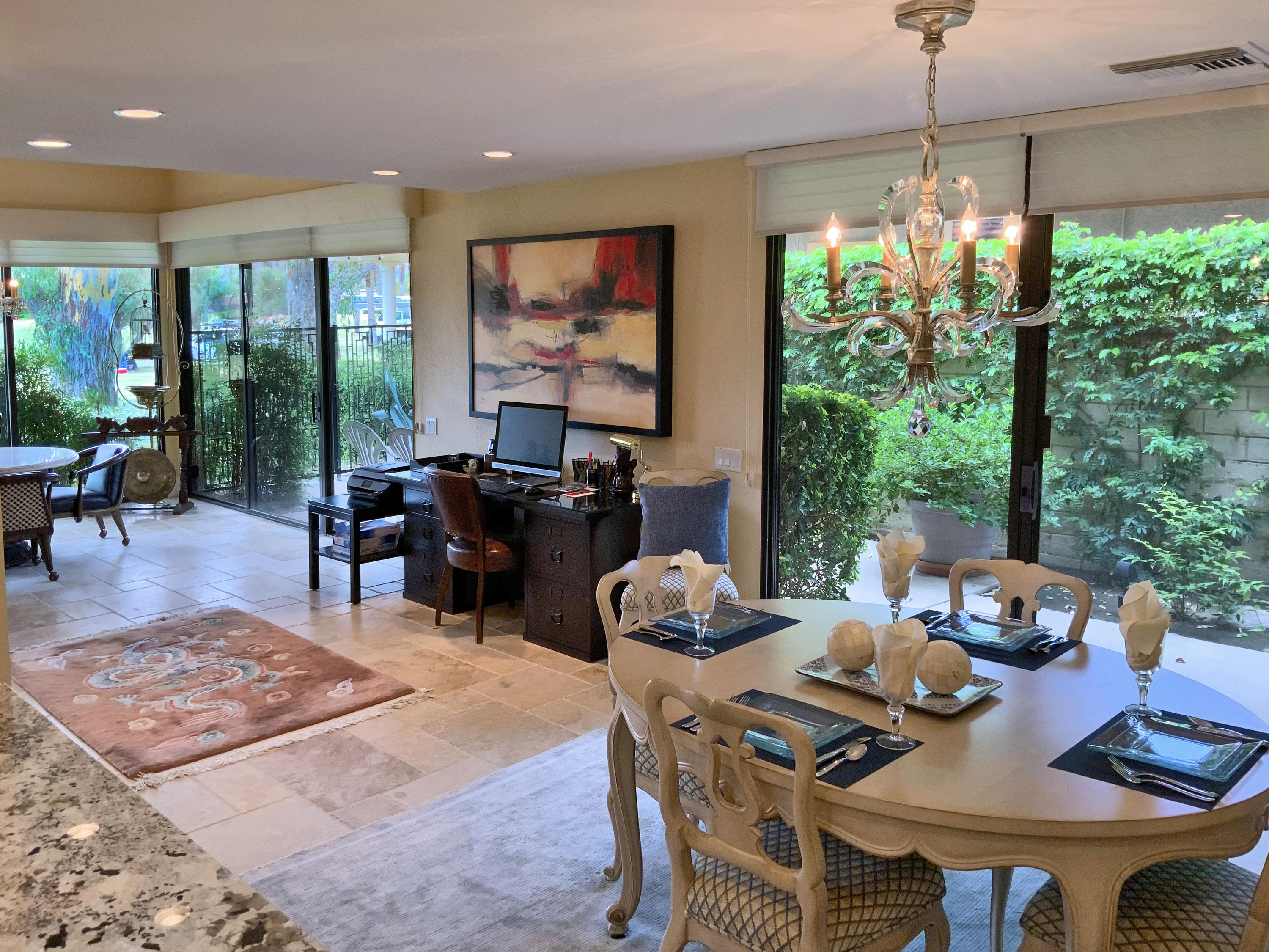 7 Princeton Drive Rancho Mirage, CA 92270 - Photo 20 of 39 a outdoor dining space with furniture and a potted plant