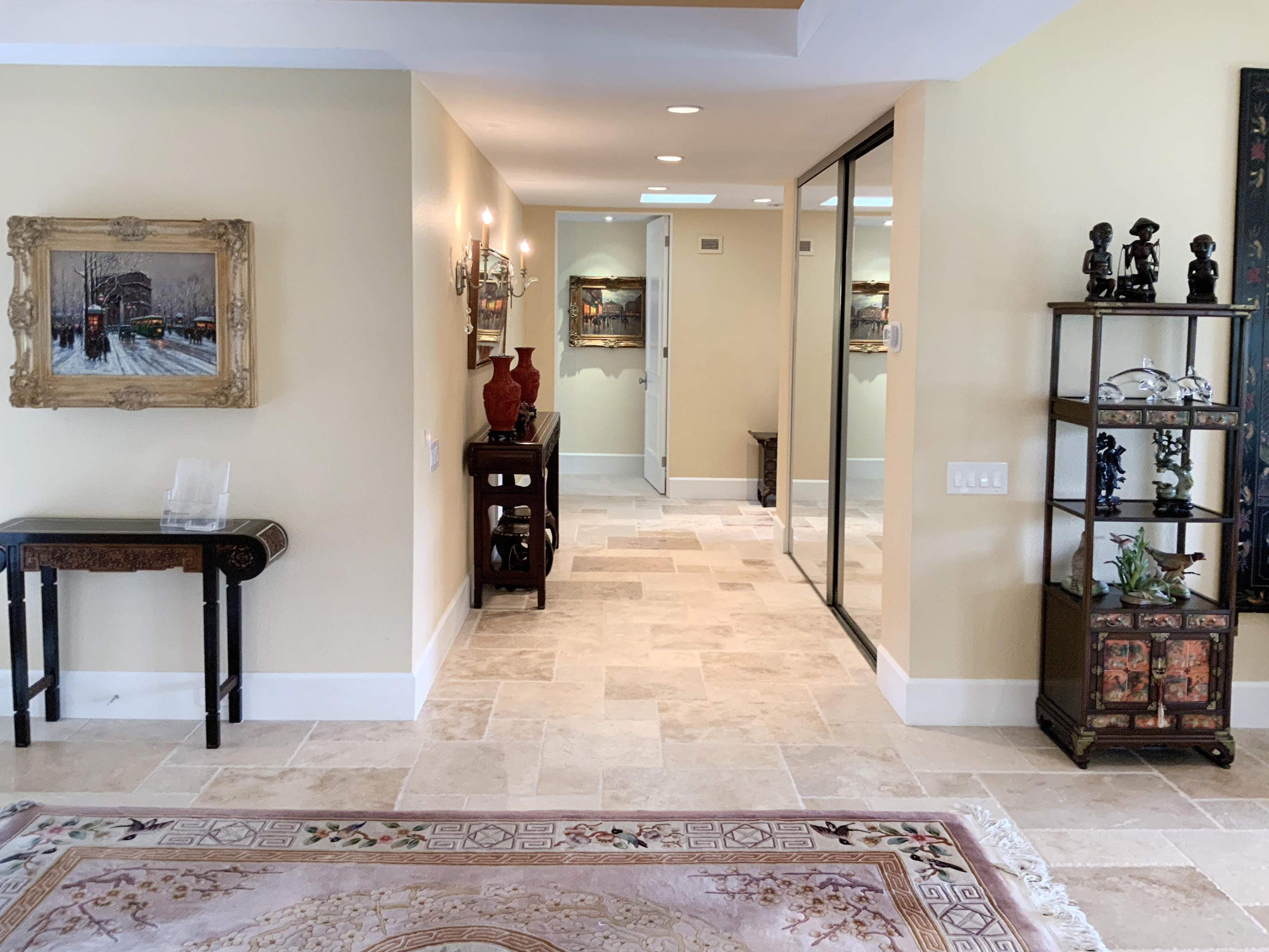 7 Princeton Drive Rancho Mirage, CA 92270 - Photo 23 of 39 a view of a hallway with cabinet and a rug