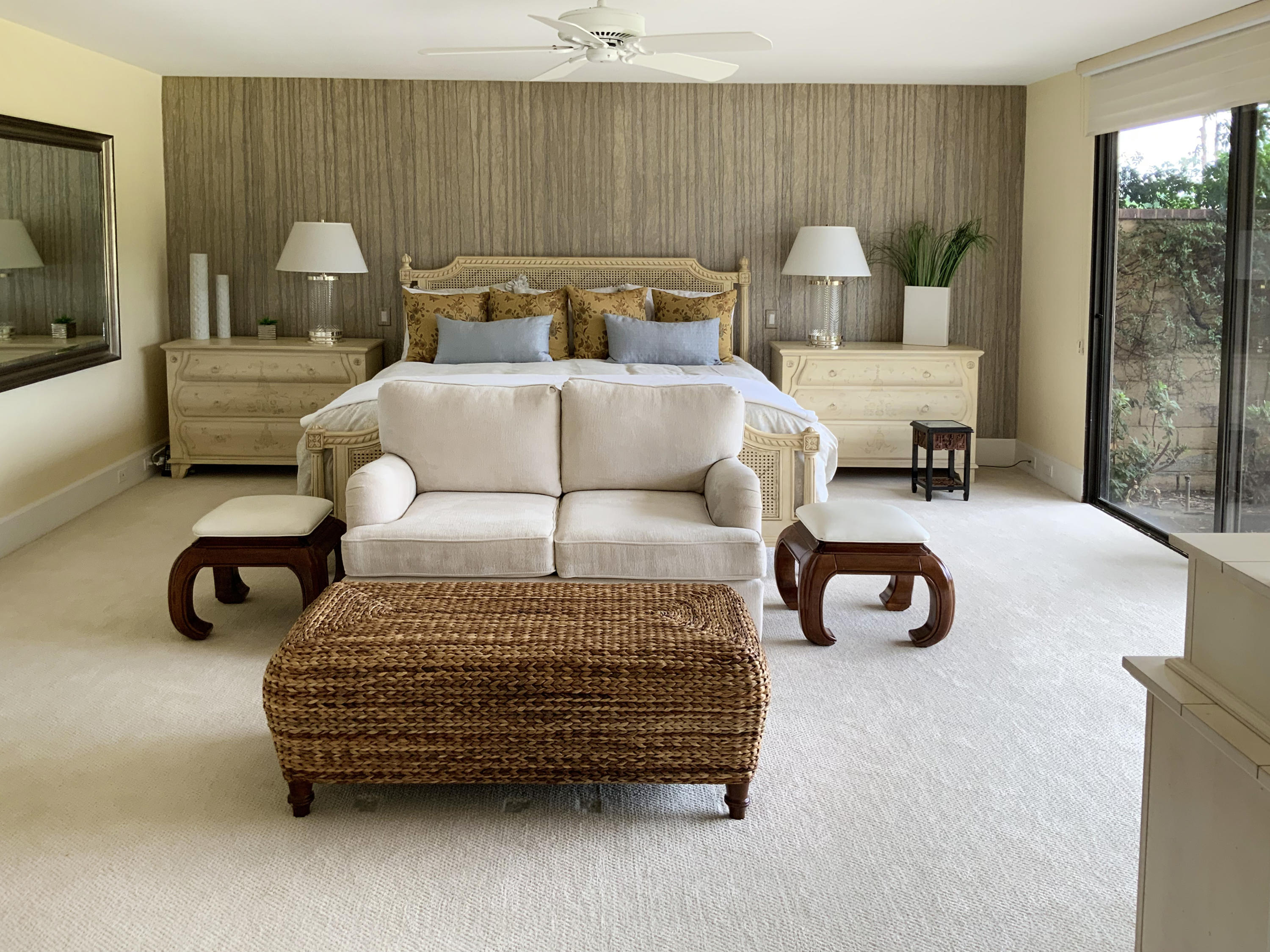 7 Princeton Drive Rancho Mirage, CA 92270 - Photo 24 of 39 a bedroom with furniture and a chandelier
