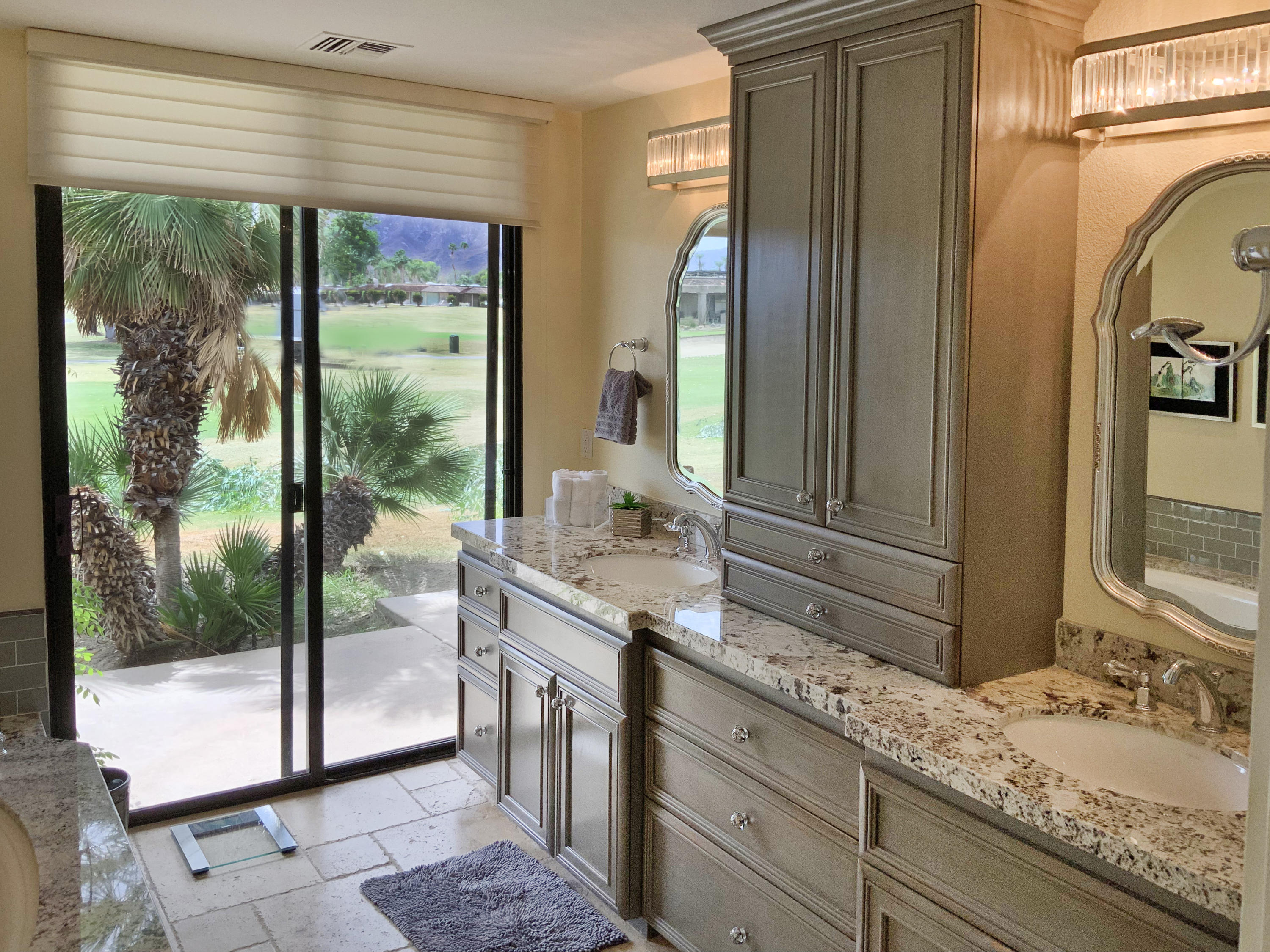 7 Princeton Drive Rancho Mirage, CA 92270 - Photo 26 of 39 a bathroom with a granite countertop sink and a mirror