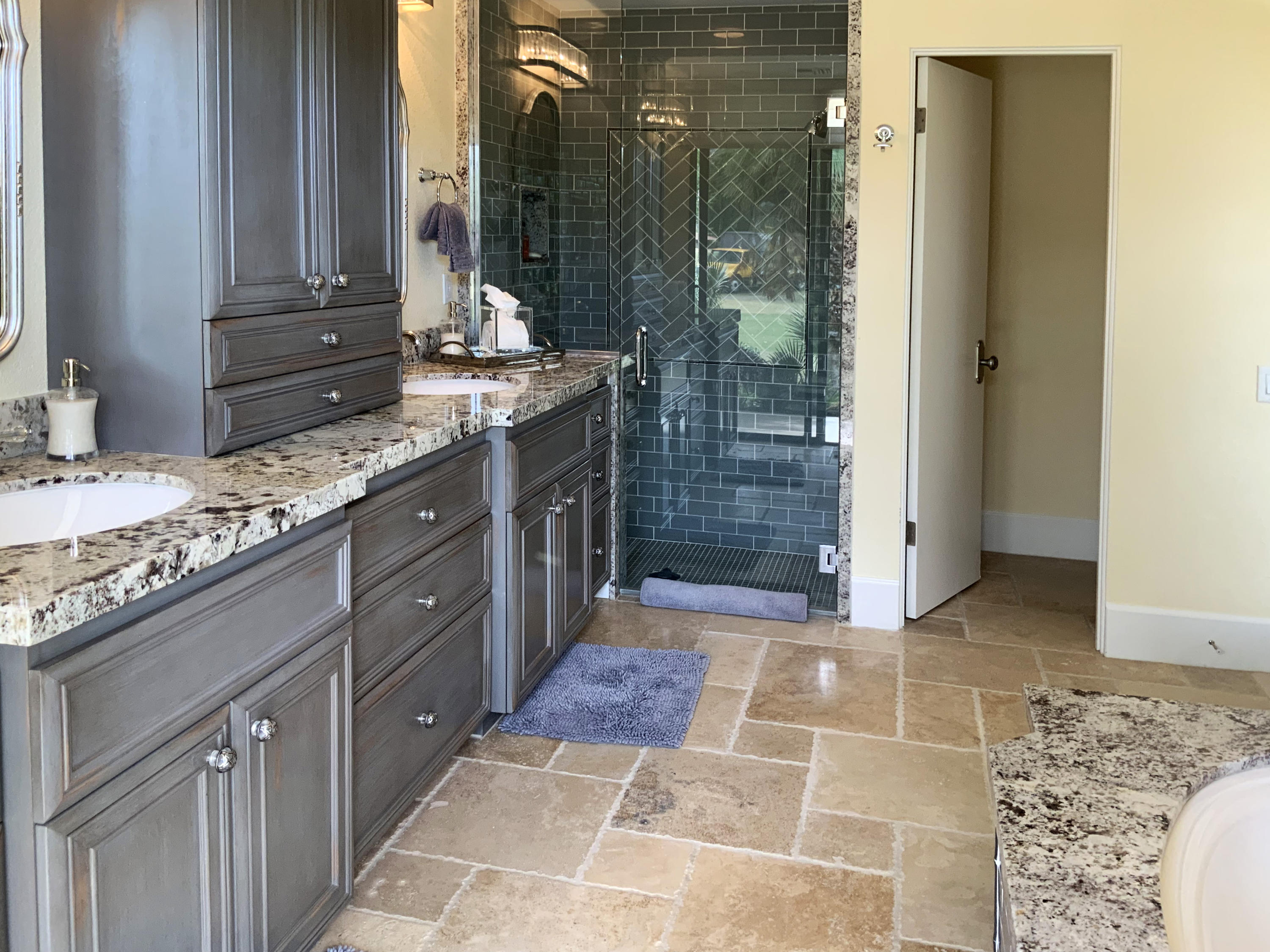 7 Princeton Drive Rancho Mirage, CA 92270 - Photo 27 of 39 a bathroom with a granite countertop sink a mirror and shower