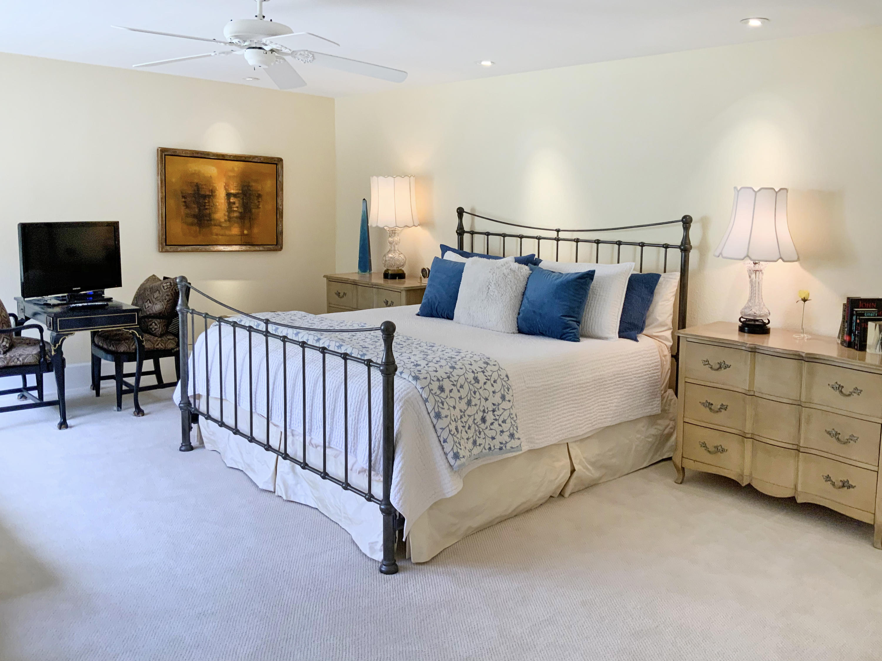 7 Princeton Drive Rancho Mirage, CA 92270 - Photo 30 of 39 a bedroom with a bed and flat screen tv