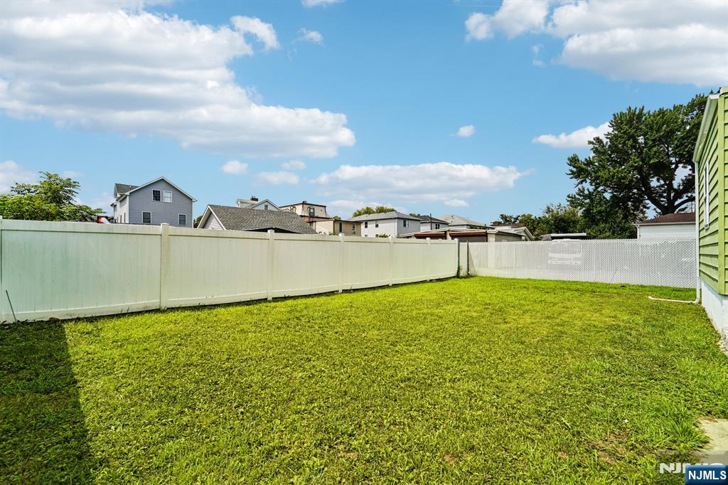 514 Madison Avenue Elizabeth, NJ 07201 - Photo 12 of 14 a view of a lake with houses in the back