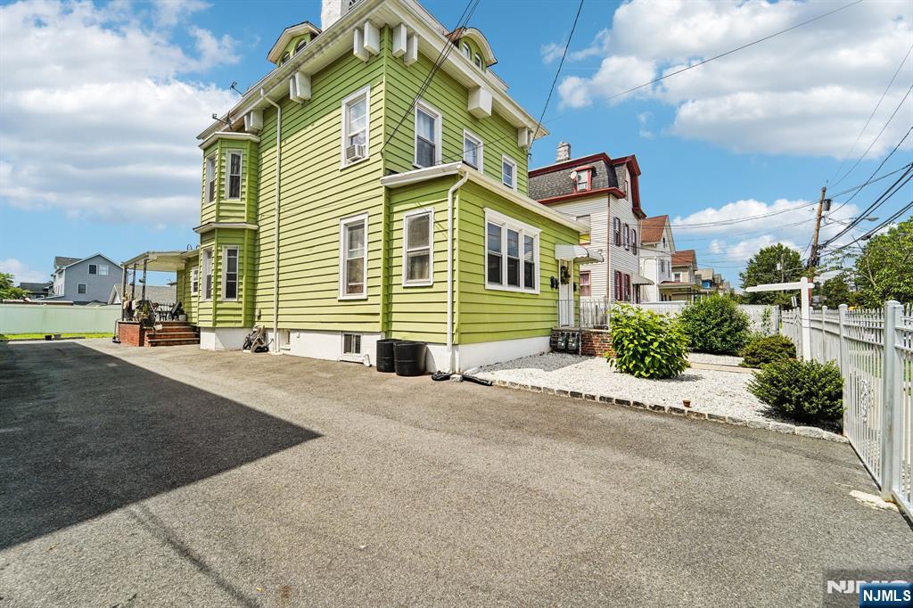 514 Madison Avenue Elizabeth, NJ 07201 - Photo 14 of 14 a front view of a house with a yard