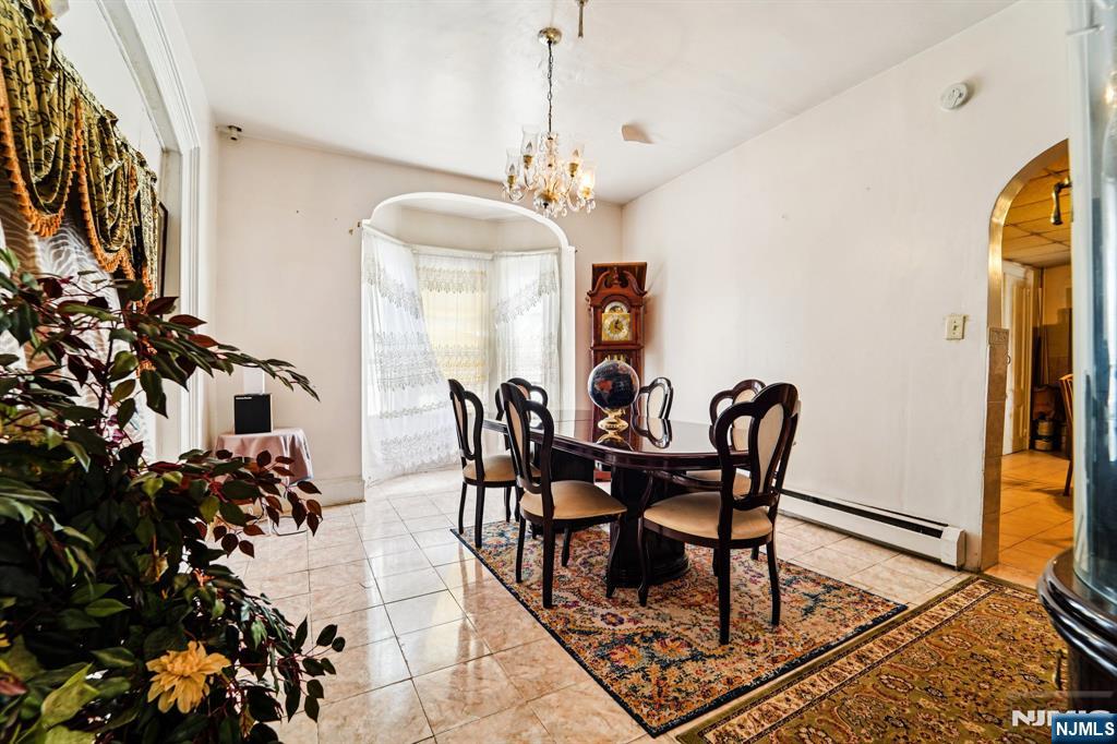 514 Madison Avenue Elizabeth, NJ 07201 - Photo 6 of 14 a view of a dining room with furniture and a chandelier