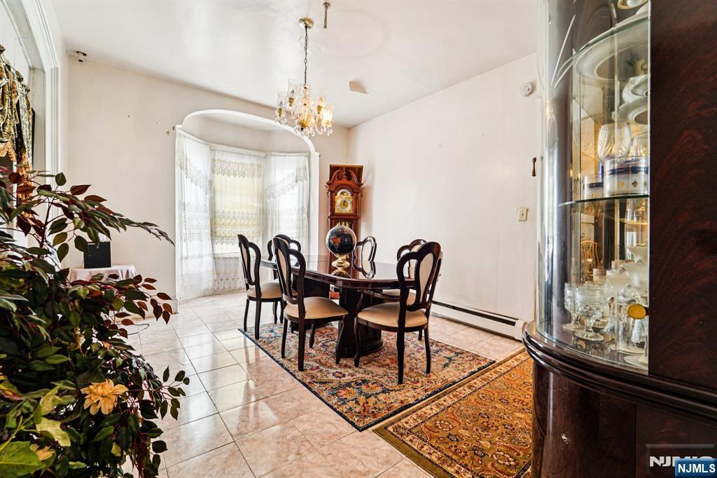514 Madison Avenue Elizabeth, NJ 07201 - Photo 7 of 14 a view of a dining room with furniture and chandelier