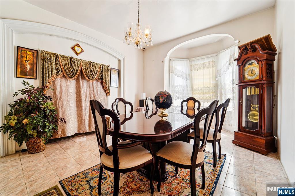 514 Madison Avenue Elizabeth, NJ 07201 - Photo 8 of 14 a dining room with furniture entryway and wooden floor