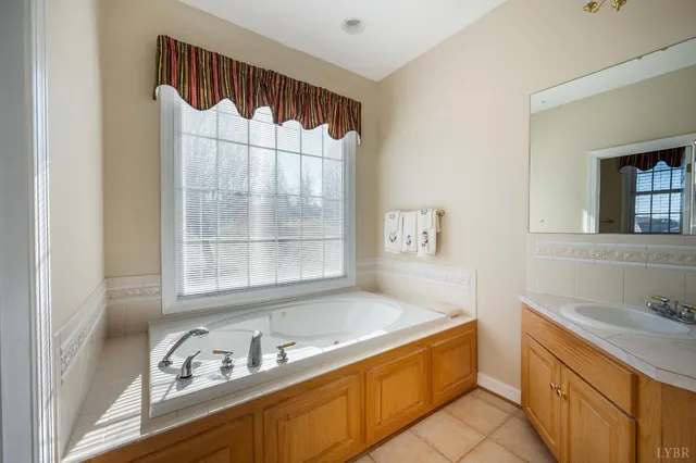 a view of an empty room with wooden floor and closet