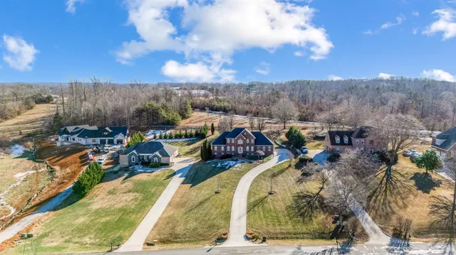 a view of an entryway with wooden floor and stairs