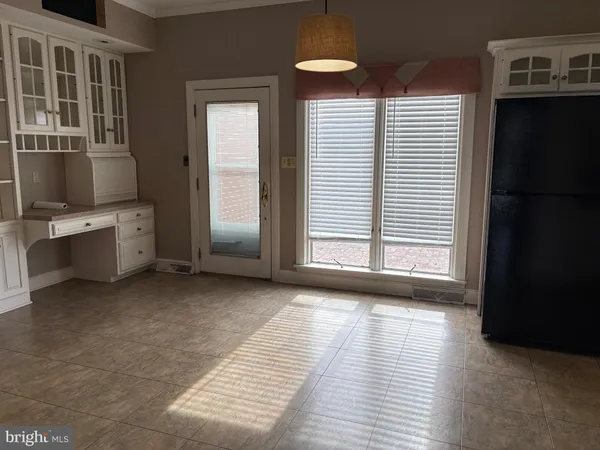 a view of a room with a large window
