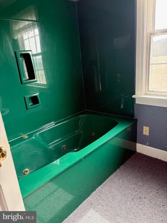 a bathroom with a sink and mirror