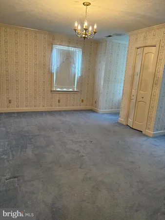a view of a livingroom with wooden floor and closet
