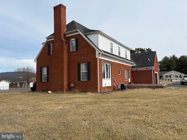 a big house with a big yard and more windows