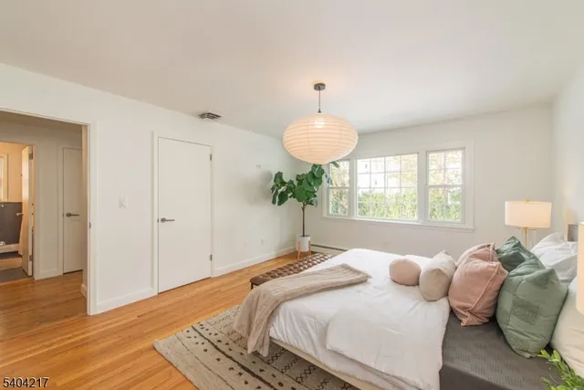 a bedroom with bed and a lamp