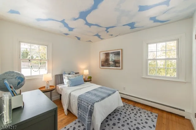 a bedroom with a bed and a table in it