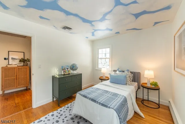 a bathroom with a sink toilet and mirror