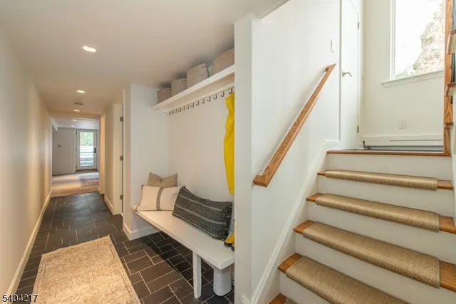 a view of a room with wooden floor